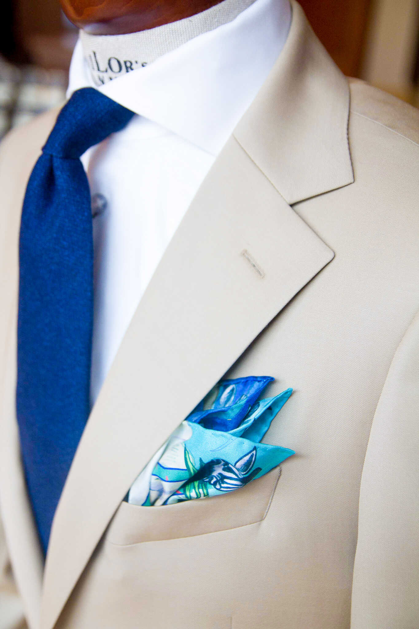 A single-breasted beige suit